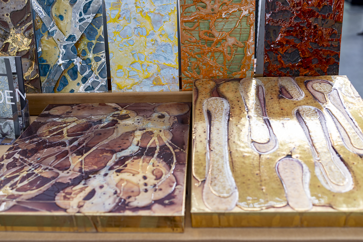 Material samples with strong color and texture variations, shown as inspiration for materials in office design.