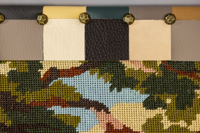 Historical textile upcycling wall panel with embroidered flamingo motif and hand-cut faux leather border